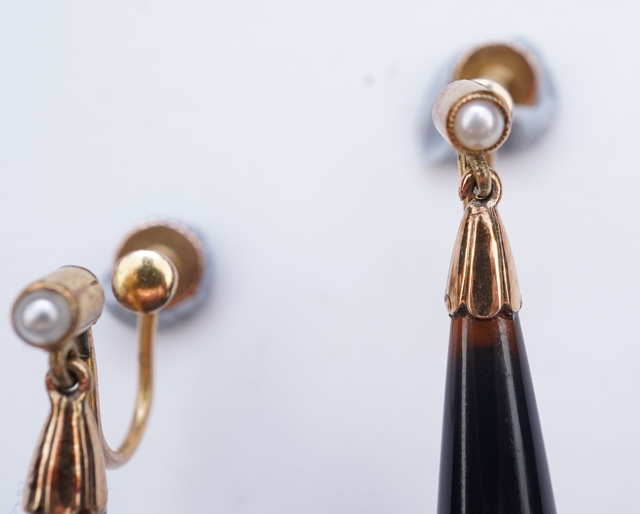 A pair of onyx and split pearl earrings, circa 1900